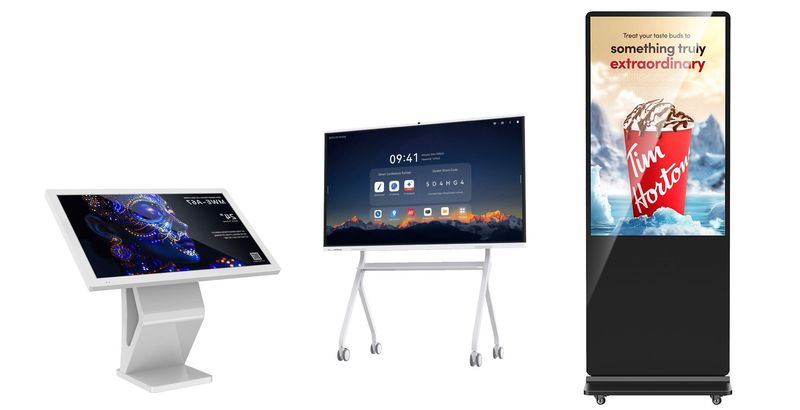 Die Abbildung zeigt moderne digitale Displaylösungen für Unternehmen, Bildungseinrichtungen und öffentliche Bereiche. Präsentiert werden eine Digital Signage Stele für aufmerksamkeitsstarke Werbung und Informationsdarstellung, ein Digital Kiosk für interaktive Selbstbedienung und Kundeninformation sowie ein interaktives Whiteboard für digitale Meetings, Präsentationen und Zusammenarbeit. Die hochwertigen Touch-Displays überzeugen durch brillante Bildqualität, intuitive Bedienung und vielseitige Einsatzmöglichkeiten.